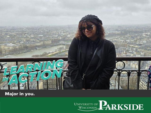 UW-Parkside student, Sheridan Ewald, poses in front of a city view of Paris, France during her time studying abroad.
