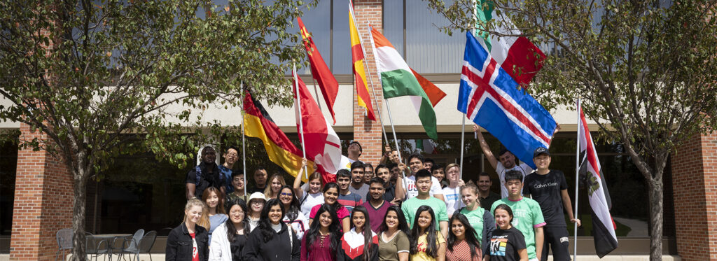image of international students holding flags standing in front of UW-Parkside