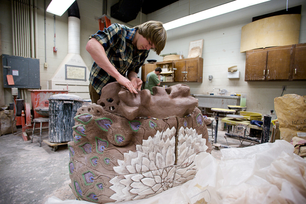 UWP Student working on ceramic sculpture