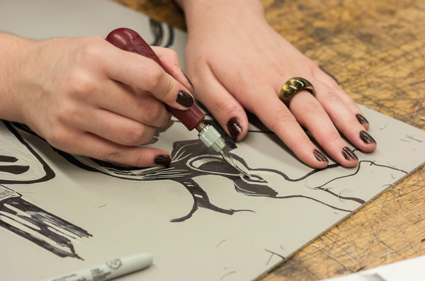 UWP Art Student working on a Lino print
