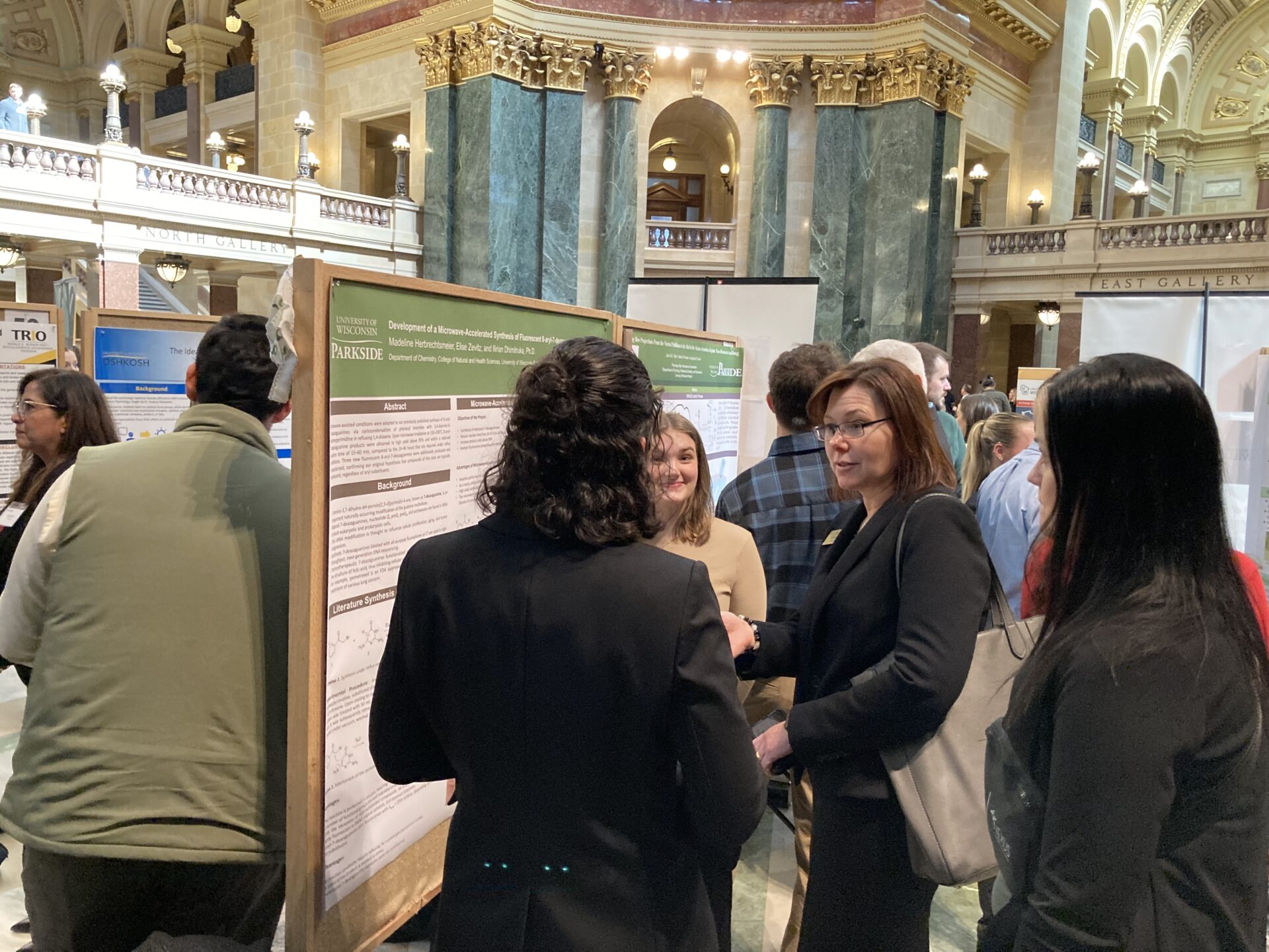 Chancellor Akey listens to UW-Parkside's students' research presentations