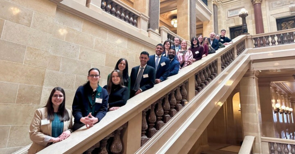 UW-Parkside students pose on a staircase at the Wisconsin State Capitol